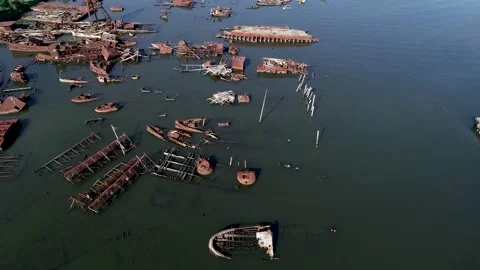 Ships decaying at the Arthur Kill Ship graveyard along the Arthur Kill Stock Footage 135591275