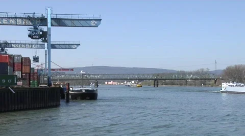 Ships down the river and container gets loaded Stock Footage 671649