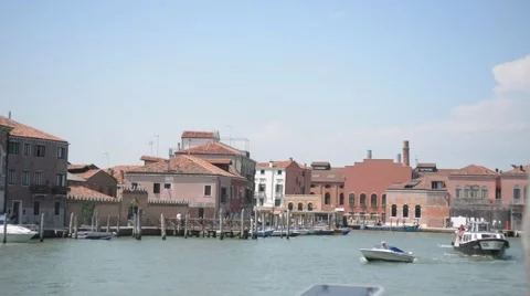 Ships float along the pier on the waterfront of Murano island in Venice. Stock Footage 52104834