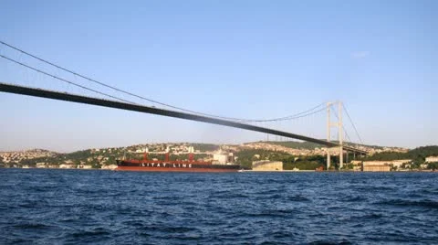 Ships float near Bosporus Bridge against city landscape Stock Footage