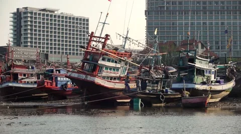 Ships On The Ground After Low Tide on the background of large buildings. Stock Footage 47369028
