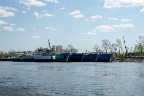 Ships in the spring on the river in the docks Stock Photos