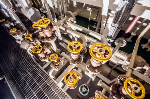Ships valves, main engine - engineering interior 写真素材