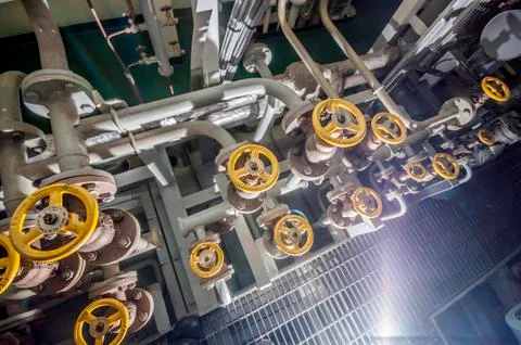 Ships valves, main engine - engineering interior Stock Photos