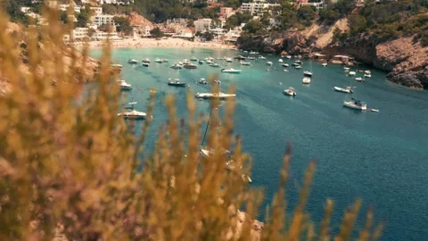 Ships which are in a bay, surrounded by hills, houses, beach Vídeos de archivo 230077720