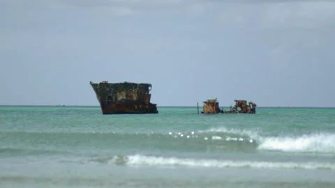 Shipwreck by the beach and waves Stock Footage 253614530
