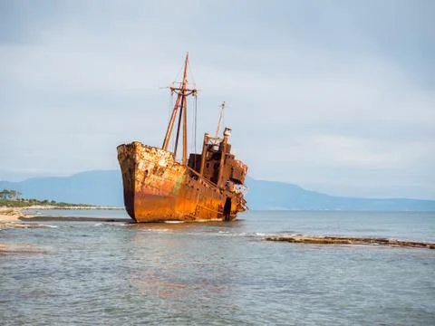 Shipwreck in a beach Stock Photos