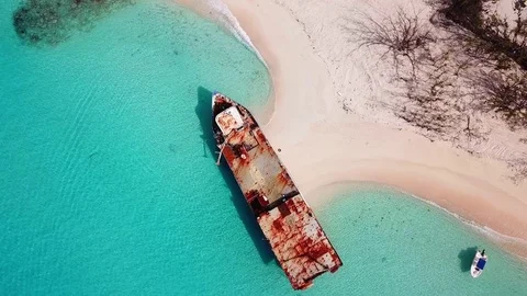 A shipwreck sits in clear waters on a beach in Grand Turk island. Stock Footage 83558989