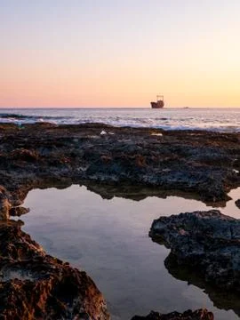 Shipwreck at sunset Stock Photos