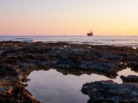 Shipwreck at sunset Stock Photos