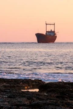 Shipwreck at sunset Stock Photos