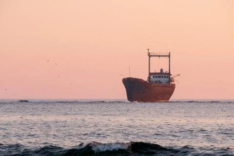 Shipwreck at sunset Stock Photos