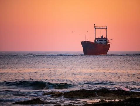 Shipwreck at sunset Stock Photos