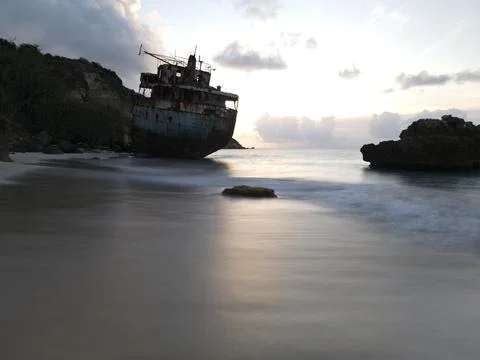 Shipwreck at sunset  Stock Photos
