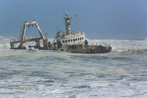 Shipwreck in waves Stock Photos