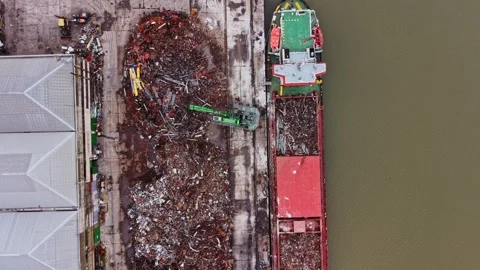Shipyard activity at cargo terminal with vessel loading materials 動画素材 337942234