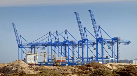Shipyard cranes unloading cargo, container port Stock Footage 49422137