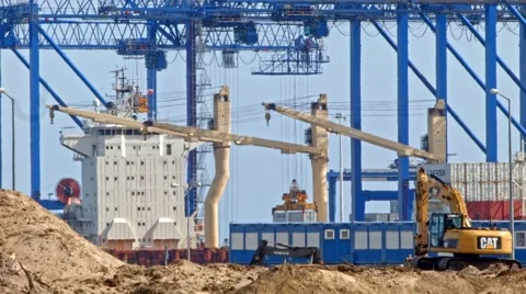 Shipyard cranes unloading cargo, container port closeup Stock Footage 49422514