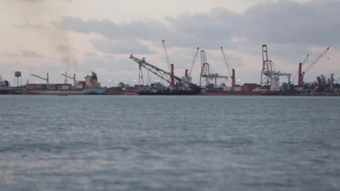 Shipyard at sunset across the sea Stock Footage 135616706