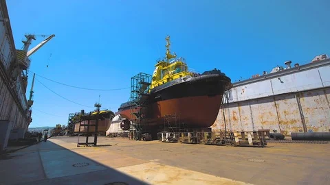 Shipyard. Three Ships in Repair in a Floating Dock. Overhaul and Modernization Stock Footage 95854693