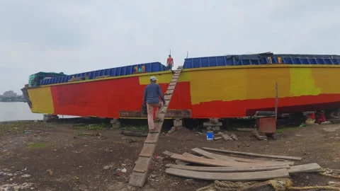 Shipyard Worker Boarding Brightly Painted Cargo Boat Bangladesh Stock Footage 337983492