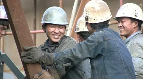 Shipyard workers are laughing and look into the camera - China Video stock 10950311
