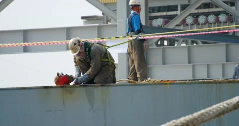 Shipyard workers collect tools after work on the deck of the ship. Stock Footage 166387820