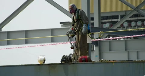 Shipyard workers collect tools after work on the deck of the ship. Stock Footage 166389189