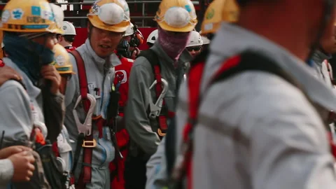 Shipyard workers disperse after a pre-work meeting. Stock Footage 184022858