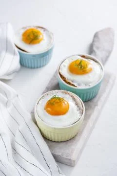 Shirred baked eggs for breakfast. Selective focus copy space Stock Photos
