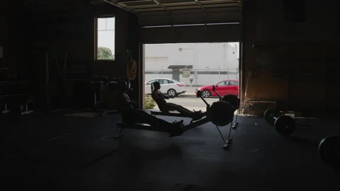 Shirtless Athletes Rowing at the Gym | Stock Video | Pond5