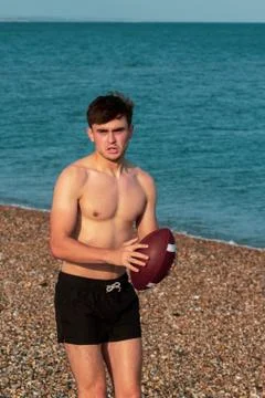 Shirtless on a beach Stock Photos