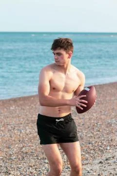 Shirtless on a beach Stock Photos
