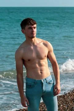 Shirtless on a beach Stock Photos
