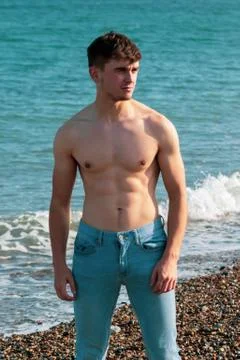 Shirtless on a beach Stock Photos