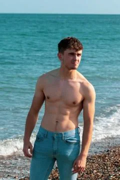 Shirtless on a beach Stock Photos