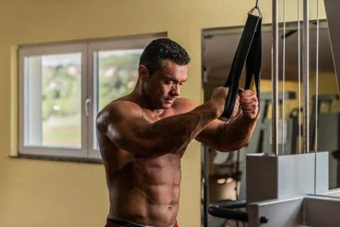 Shirtless bodybuilder preparing for his exercise Stock Photos