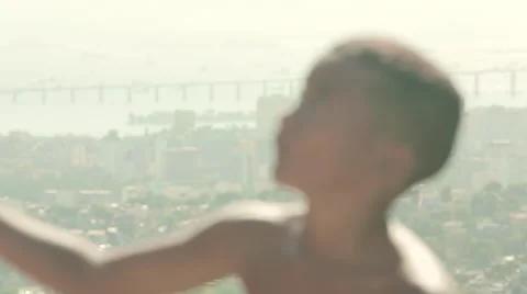 Shirtless boy flying a kite Stock Footage 61273662