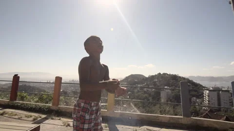 Shirtless boy flying a kite Stock Footage 61292356