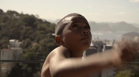 Shirtless boy flying a kite Stock Footage 61292358