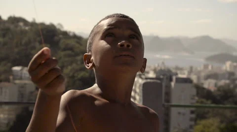 Shirtless boy flying a kite Stock Footage 61292366