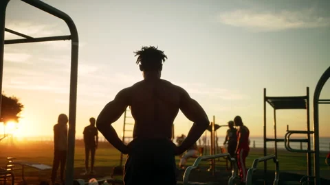 Shirtless buffed man looking at other people in the park Stock Footage 279299173
