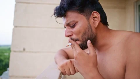 Shirtless Man Crying While Smoking Stock-Footage 291663045