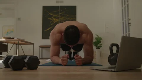 Shirtless Man Does an Ab Workout at Home 스톡 동영상 222008725