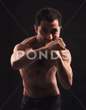 Shirtless man ready for combat Stock Photos