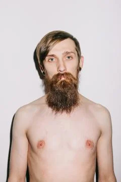 Shirtless man staring at camera Stock Photos