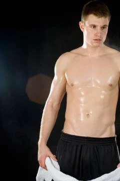 A shirtless man sweating Stock Photos