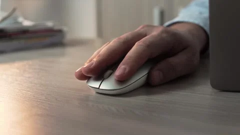 Shirtless man's hand on computer mouse in office at desk. Stock Footage 307598506