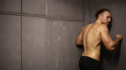 Shirtless young man in corner Video stock 63331810