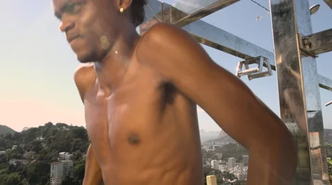 A shirtless young man doing workout Stock Footage 61292046